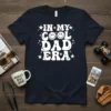 In My Cool Dad Era text with smiley faces and stars on a navy t-shirt