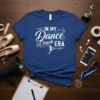 Blue t-shirt with white and teal text "In My Dance Coach ERA" and a silhouette of a dancer