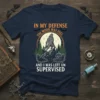 T-shirt with text "In My Defense The Moon Was Full And I Was Left Unsupervised" featuring a howling werewolf under
