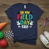 In My Field Day Era text design with colorful letters and peace signs on a navy t-shirt