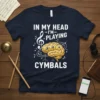 T-shirt design with text "In My Head I'm Playing Cymbals" featuring a brain graphic and musical notes