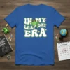 In My Leap Day Era text with a cool frog wearing sunglasses and a party hat on a blue t-shirt