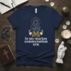 Navy t-shirt with white text "in my marian consecration era" above a graphic of Mary and Jesus, surrounded by stars