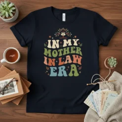 T-shirt with "IN MY MOTHER IN LAW ERA" text in retro wavy font, featuring a tree graphic