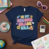 In My Second Grade Era t-shirt design with colorful retro typography, rocket, sun, flower, and schoolhouse graphics