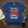 In My Talent Show Era text with microphone, ballet shoes, guitar, and spotlight graphic on a blue t-shirt