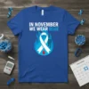 In November We Wear Blue Diabetes Awareness t-shirt featuring a white ribbon with a red drop on blue flames