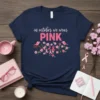 Navy blue t-shirt with "in october we wear PINK" text and a design of pink ribbons, flowers, and birds on