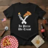 In Pizza We Trust t-shirt with a graphic of crossed arms holding a torch and a slice of pizza