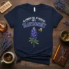 Navy blue t-shirt with "In a World Full of Roses Be a Bluebonnet" text and a bluebonnet flower graphic with