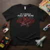 Black t-shirt with white and red text that reads "In A World Full Of Tens Be An Eleven" in a