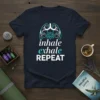 Inhale exhale REPEAT t-shirt with a turquoise lung and lotus graphic, perfect for yoga and meditation