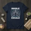 Inhale Exhale t-shirt design featuring stylized lungs and circular wave graphics, promoting mindfulness and respiratory wellness