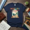 INTERIOR Designer text with graphic of armchair and plant inside an archway on a navy t-shirt