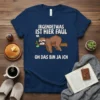 T-shirt with German text "IRGENDETWAS IST HIER FAUL OH DAS BIN JA ICH" and a cartoon sloth hanging on a