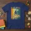 Board game graphic tee with "Is It Still Your Turn???" text and a player figure waiting at a game board