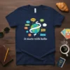 Navy blue t-shirt with the phrase "it starts with hello" and a graphic of the Earth surrounded by greetings in