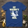 It Wasn't Me. funny cat t-shirt design with a cool cat holding a banana and smoking, a palm tree, and