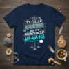 Navy blue t-shirt with the quote "IT'S CALLED KARMA AND IT'S PRONOUNCED HA HA HA" in stylized text, featuring scales