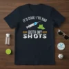 T-shirt with white text "IT'S COOL! I'VE HAD BOTH MY SHOTS" and graphics of a syringe and lime slices