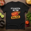 It's Gotta Be The Salsa SALSA text with a flaming hot sauce bottle graphic on a black t-shirt