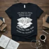 Black t-shirt with white text and illustration: "it's hard to think outside the box always buried outside the box alwan