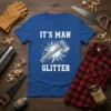 It's Man Glitter t-shirt design with a white axe graphic and distressed background, featuring bold white text