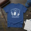 White text and graphics of a drum, tuba, and saxophone reading "IT'S MARCHING BAND SEASON" on a blue t-shirt