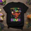 It's Mardi Gras Bruh text with a cartoon crawfish wearing a jester hat and holding a cupcake and mask, on