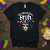 It's Mardi Gras Bruh text with a jester mask graphic, surrounded by colorful stars on a black t-shirt
