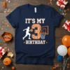 Navy blue t-shirt with "IT'S MY 3 BIRTHDAY" text, a basketball player dribbling, and a basketball hoop graphic