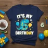 It's My 6th Birthday text with a blue dinosaur graphic and balloons on a navy t-shirt