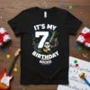 Black t-shirt with "IT'S MY 7 BIRTHDAY ROCKS!" text, a cartoon panda playing a guitar, and musical notes for a
