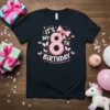 Black t-shirt with "It's My 8th Birthday" in pink text, featuring a large pink bow and small butterflies