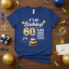 IT'S MY Birthday! 60 YEARS LOVED, CHEERS TO MORE! text with cake and balloons on a blue t-shirt for a