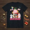 It's My Birthday t-shirt design featuring four cartoon dogs wearing party hats and a birthday cake with candles
