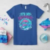 It's My Birthday t-shirt design featuring three colorful dolphins jumping in waves under a turquoise circle, with stars and text