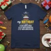 T-shirt featuring "it's my BIRTHDAY I mean ES MI CUMPLEAÑOS ES IST MEIN GEBURTSTAG C'EST MON ANNIVERSAIRE" text with a
