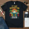 It's My Graduation Cruise 2026 text with cruise ship, palm trees, and sunset graphic on a navy t-shirt