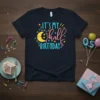 It's My Half Birthday t-shirt with a smiling moon, stars, and festive shapes