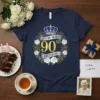 It's My Mom's 90th Birthday text with crown and floral wreath on a navy t-shirt