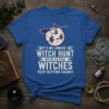 T-shirt with white text "IT'S NO LONGER A WITCH HUNT WHEN ACTUAL WITCHES KEEP GETTING CAUGHT" and witch silhouettes flying