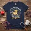 It's Not Dog Hair It's Canine Confetti text with a happy golden retriever graphic on a navy t-shirt