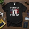 Black t-shirt with white text "It's Not Gay If It's TSA" over a distressed American flag graphic and TSA icons