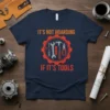 It's Not Hoarding If It's Tools quote on a navy t-shirt with a gear graphic featuring wrenches, screwdrivers, and pliers