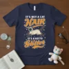 IT'S NOT A CAT HAIR IT'S A KITTY Glitter text with a playful Siamese cat graphic on a navy blue