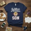 Navy t-shirt with "It's Official I'M The Favorite Son" text and a gold trophy graphic