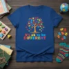 It's ok to be different autism awareness tree design with colorful puzzle pieces on a blue t-shirt