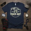 Navy blue t-shirt with "IT'S TRACK DAY!" text and a graphic of a race car in motion