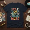 T-shirt with "It's A Good Day To Make Music" in colorful retro font surrounded by musical notes